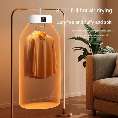 Clothing dryer with a shirt inside, placed in a room with a couch and plant.