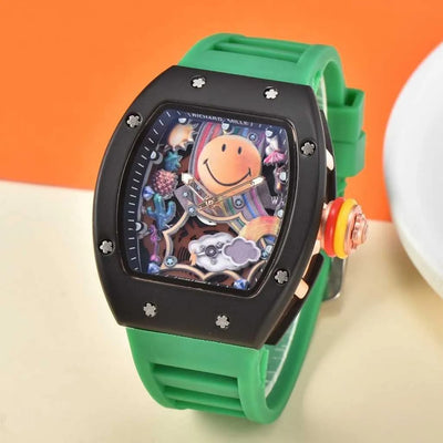 Watch with a green strap and colorful face on an orange and beige background